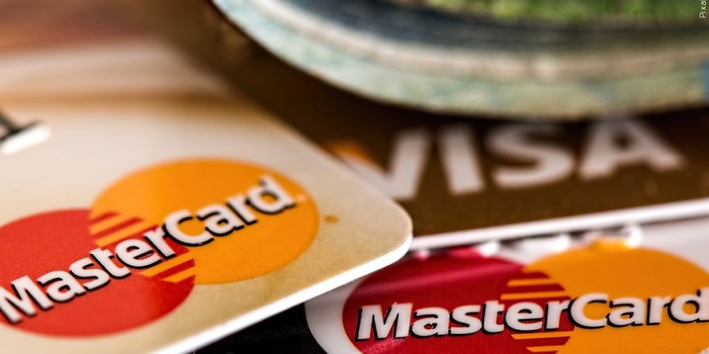 Can businesses charge you a fee for using a debit card?